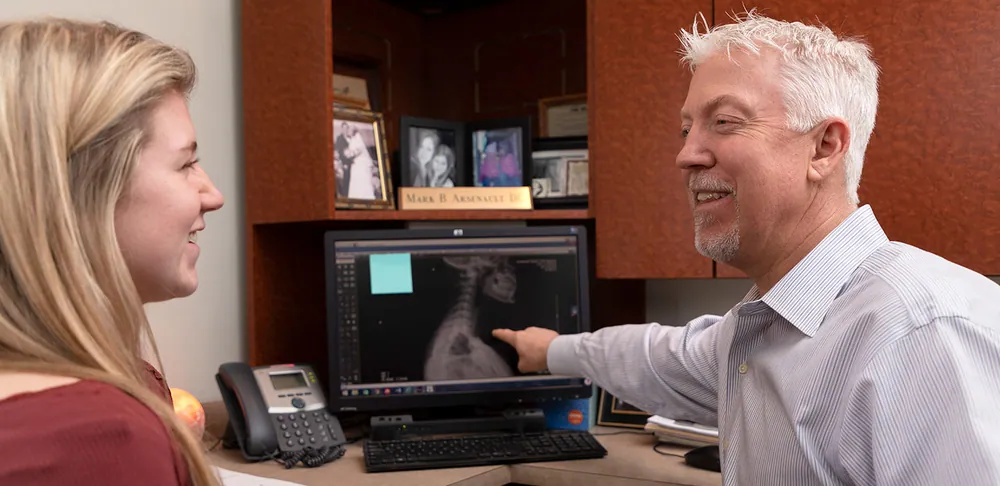 Chiropractic treatment with spine x-ray review