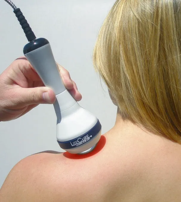 woman having a laser therapy on her back