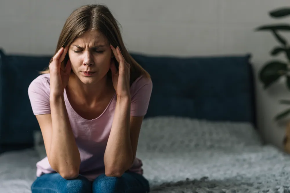 woman suffering from headache and migraine