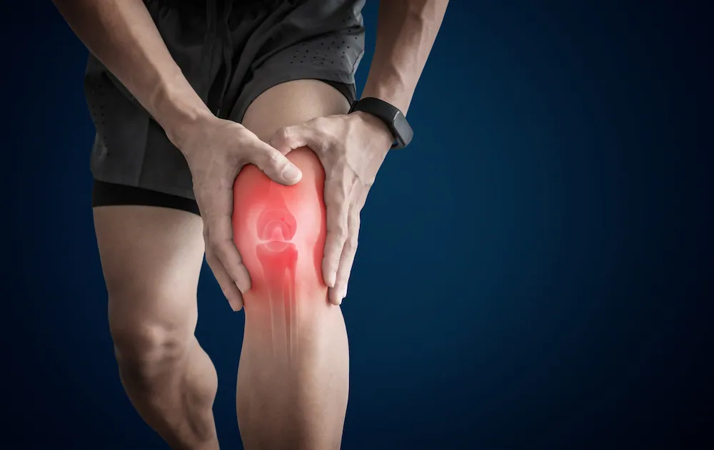 man having a knee pain form overuse injury