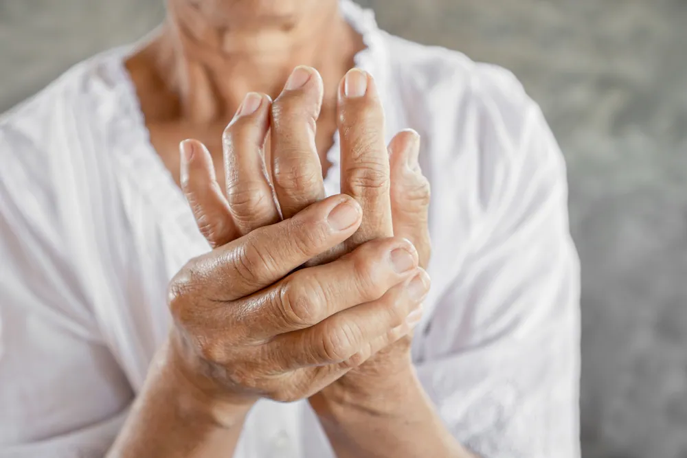 old woman having arthritis on her hand